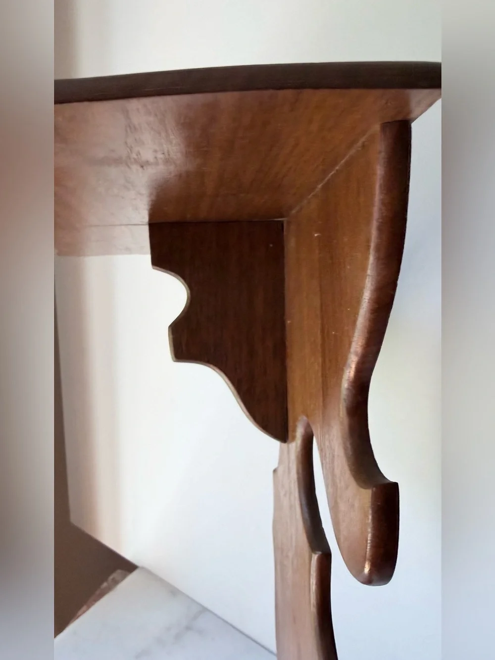 vintage wall sconce shelf made of carved wood with a dark finish